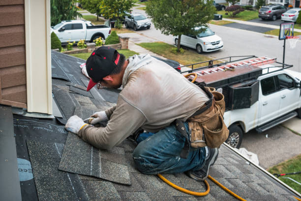 Professional Roofing technician working in Bond, CO